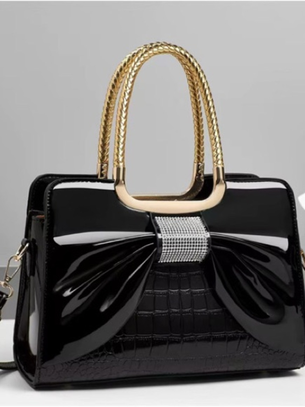 Elegant Black Patent Bow Handbag with Gold Handles